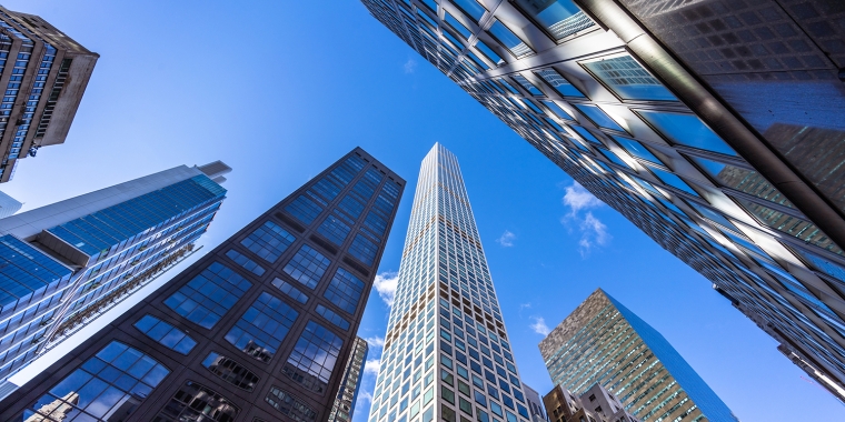 This view from West 57th Street in Midtown Manhattan looks up at the tall buildings along the street. Some of the buildings seen here are 425 Park Avenue, 450 Park Avenue, 460 Park Avenue and 432 Park Avenue.